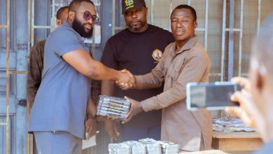 Nelson Ndebah Ndebugre presenting maths sets to education authorities