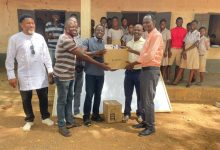Members of Visionary Buluk presenting learning materials to the school