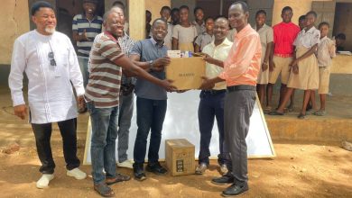 Members of Visionary Buluk presenting learning materials to the school