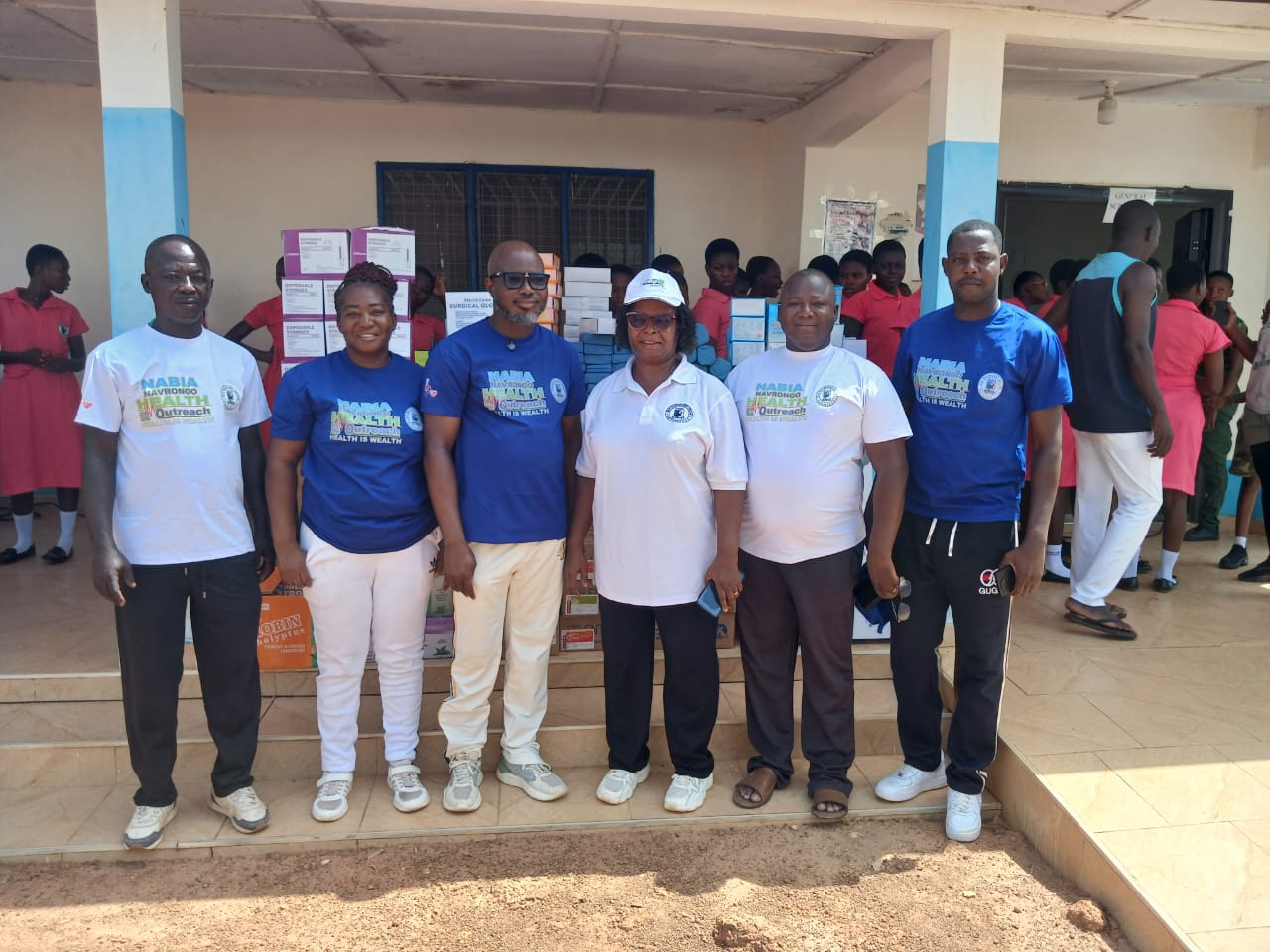 Some members of Nabia in a group picture with the Headmistress of the school.