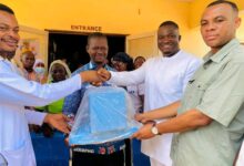 The MP and DCE handing over the donated items to staff of the hospital.
