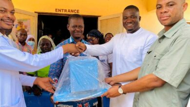 The MP and DCE handing over the donated items to staff of the hospital.