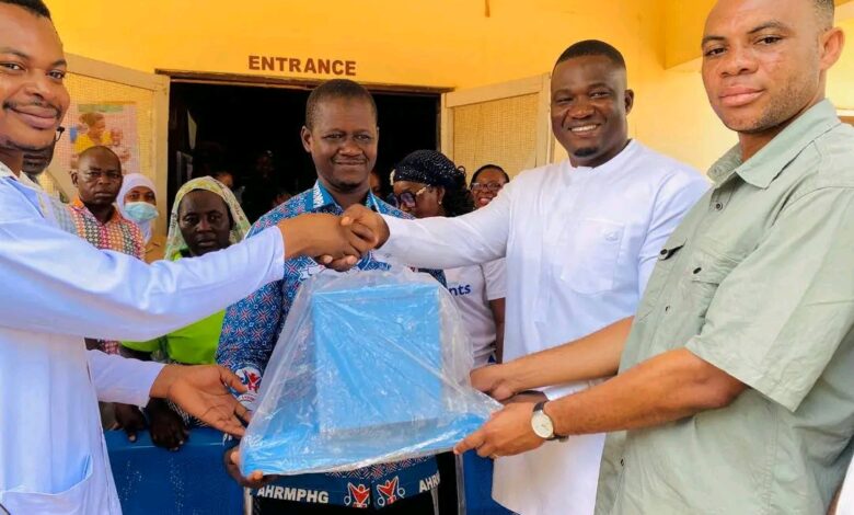 The MP and DCE handing over the donated items to staff of the hospital.