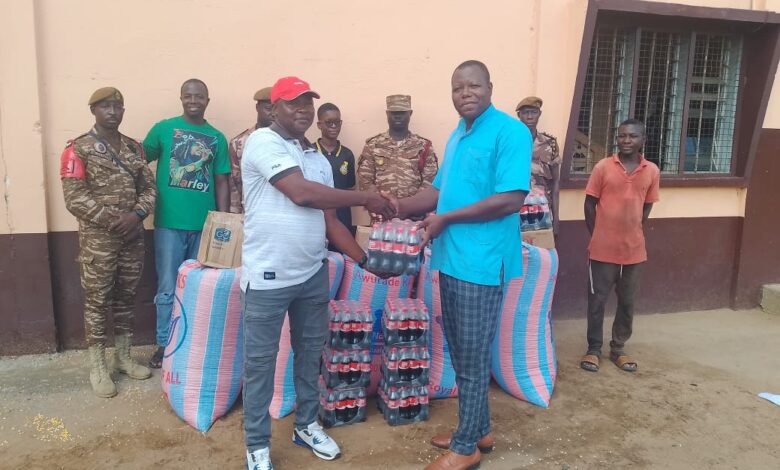 Chief Kanfosi Felix Achaab handing over the donated items to the Prison's Officials.